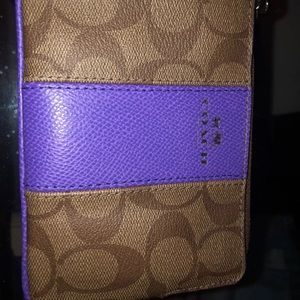 Coach wristlet purple line in middle